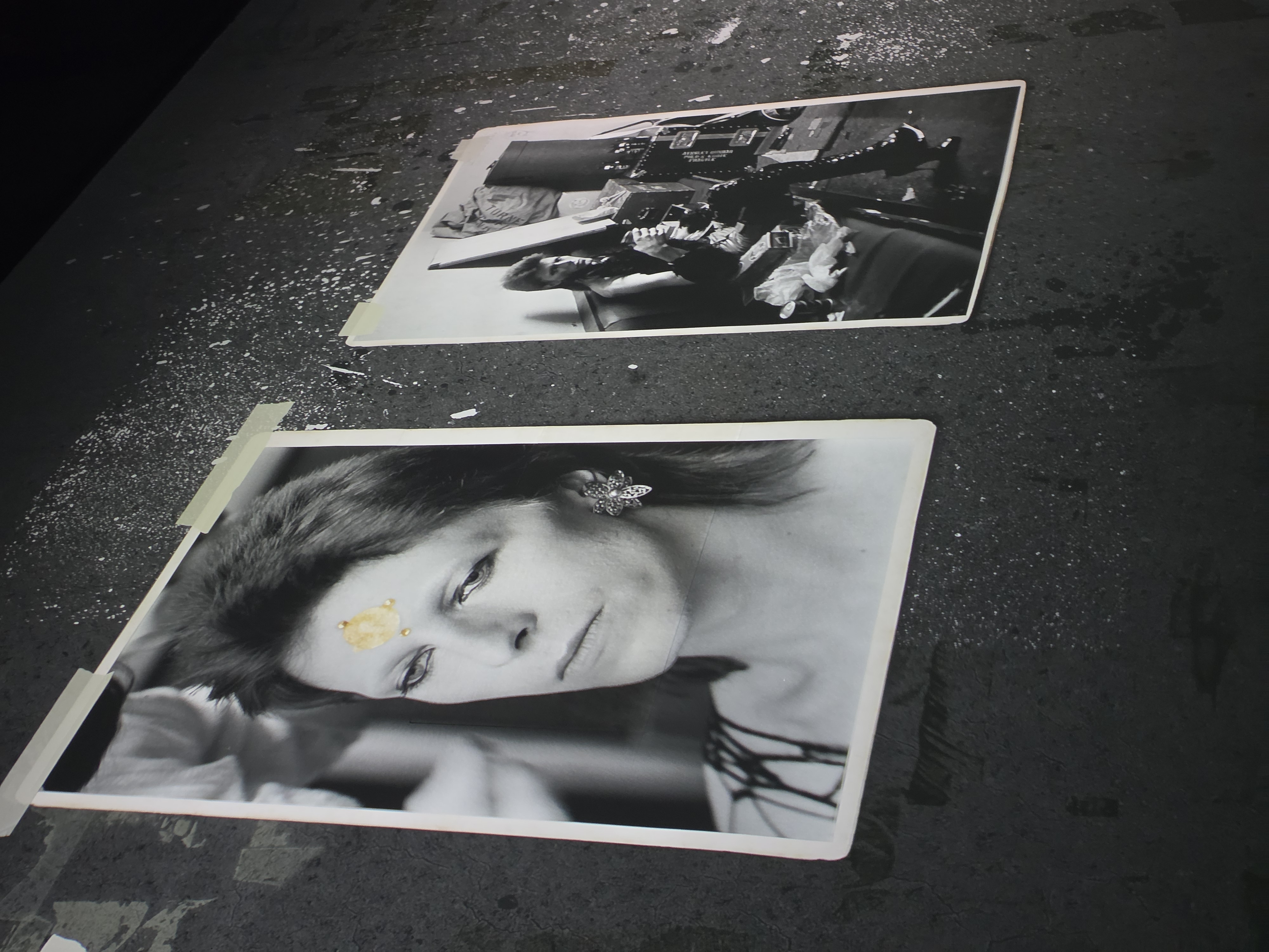 Polaroid pair on concrete wall